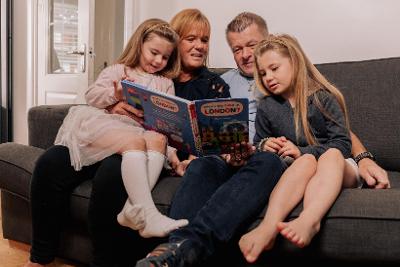 Anth and Lesley reading with two girls