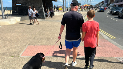 Man and boy with dog horizontal 