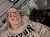 Foster carer for babies Clare sitting with one of the family dogs
