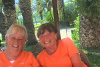 foster carers Paula and Marie in matching orange t-shirts on holiday