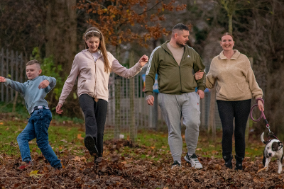 Kylie, Lee and family playing in the park